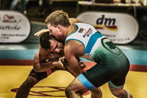 Wrestling. The Dutch for "wrestling" is "geworstel".