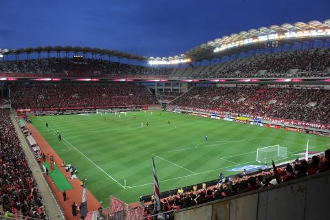 A football field. The French for "a football field" is "un terrain de football".