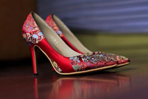 High-heels. The French for "high-heels" is "talons".