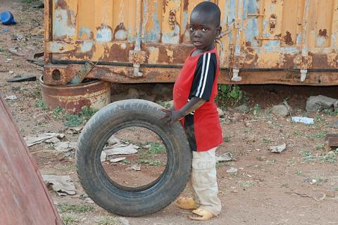 A boy and a tyre. The Thai for "a boy and a tyre" is "เด็กผู้ชายและยางรถยนต์". A boy and a tyre. The Thai for "a boy and a tyre" is "เด็กผู้ชายและยางรถยนต์".