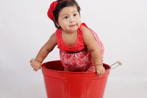 A girl and a red bucket. The Thai for "a girl and a red bucket" is "เด็กผู้หญิงและถังน้ำสีแดง". A girl and a red bucket. The Thai for "a girl and a red bucket" is "เด็กผู้หญิงและถังน้ำสีแดง".