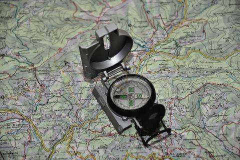 A compass and a map. The Thai for "a compass and a map" is "เข็มทิศและแผนที่". A compass and a map. The Thai for "a compass and a map" is "เข็มทิศและแผนที่".