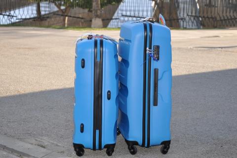 Two blue suitcases. The Thai for "two blue suitcases" is "กระเป๋าเดินทางสีน้ำเงินสองใบ". Two blue suitcases. The Thai for "two blue suitcases" is "กระเป๋าเดินทางสีน้ำเงินสองใบ".