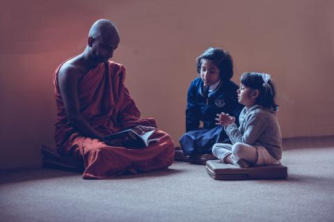 A monk and two girls. The Thai for "a monk and two girls" is "พระและเด็กผู้หญิงสองคน". A monk and two girls. The Thai for "a monk and two girls" is "พระและเด็กผู้หญิงสองคน".