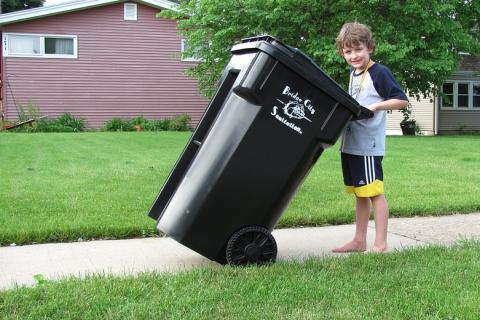 A boy and a black rubbish bin. The Thai for "a boy and a black rubbish bin" is "เด็กผู้ชายและถังขยะสีดำ". A boy and a black rubbish bin. The Thai for "a boy and a black rubbish bin" is "เด็กผู้ชายและถังขยะสีดำ".