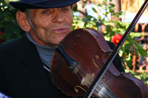 A violin and an old man. The Thai for "a violin and an old man" is "ไวโอลินและชายชรา". A violin and an old man. The Thai for "a violin and an old man" is "ไวโอลินและชายชรา".