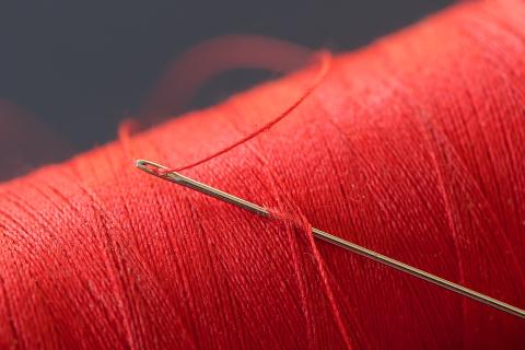 A needle and red thread. The Thai for "a needle and red thread" is "เข็มและด้ายแดง". A needle and red thread. The Thai for "a needle and red thread" is "เข็มและด้ายแดง".