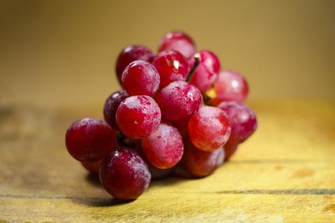 A bunch of red grapes. The Thai for "a bunch of red grapes" is "องุ่นแดงหนึ่งพวง". A bunch of red grapes. The Thai for "a bunch of red grapes" is "องุ่นแดงหนึ่งพวง".