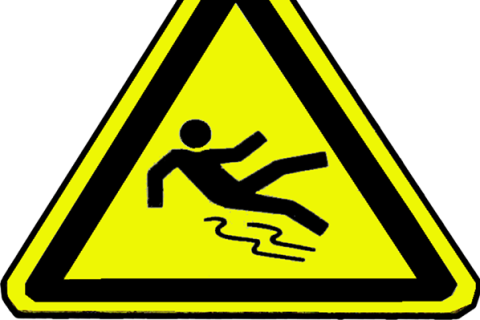 A warning sign. The Thai for "a warning sign" is "ป้ายเตือน".