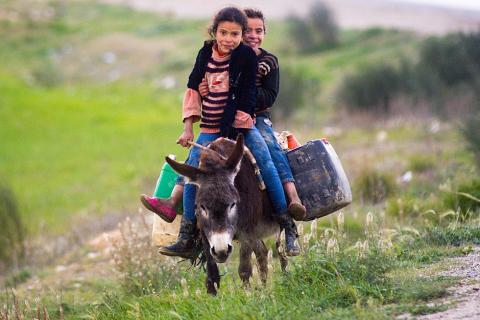 Two girls on the back of a donkey. The Thai for "two girls on the back of a donkey" is "เด็กหญิงสองคนบนหลังลา". Two girls on the back of a donkey. The Thai for "two girls on the back of a donkey" is "เด็กหญิงสองคนบนหลังลา".