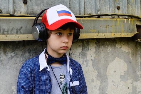 A boy with headphones and a cap. The Thai for "a boy with headphones and a cap" is "เด็กผู้ชายกับหูฟังและหมวกแก๊ป". A boy with headphones and a cap. The Thai for "a boy with headphones and a cap" is "เด็กผู้ชายกับหูฟังและหมวกแก๊ป".