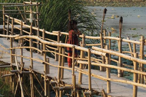 A girl on a wooden bridge. The Thai for "a girl on a wooden bridge" is "เด็กหญิงบนสะพานไม้". A girl on a wooden bridge. The Thai for "a girl on a wooden bridge" is "เด็กหญิงบนสะพานไม้".