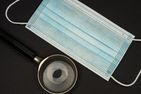A surgical mask and a magnifying glass. The Thai for "a surgical mask and a magnifying glass" is "หน้ากากอนามัยและแว่นขยาย". A surgical mask and a magnifying glass. The Thai for "a surgical mask and a magnifying glass" is "หน้ากากอนามัยและแว่นขยาย".