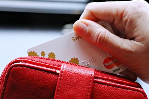 A credit card in a red wallet. The Thai for "a credit card in a red wallet" is "เครดิตการ์ดในกระเป๋าตังค์สีแดง". A credit card in a red wallet. The Thai for "a credit card in a red wallet" is "เครดิตการ์ดในกระเป๋าตังค์สีแดง".