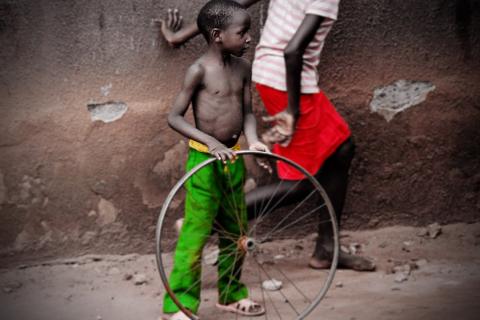 A boy with a bicycle wheel. The Thai for "a boy with a bicycle wheel" is "เด็กผู้ชายกับล้อรถจักรยาน". A boy with a bicycle wheel. The Thai for "a boy with a bicycle wheel" is "เด็กผู้ชายกับล้อรถจักรยาน".