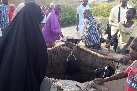 A group of people around a well. The Thai for "a group of people around a well" is "กลุ่มคนรอบบ่อน้ำ". A group of people around a well. The Thai for "a group of people around a well" is "กลุ่มคนรอบบ่อน้ำ".