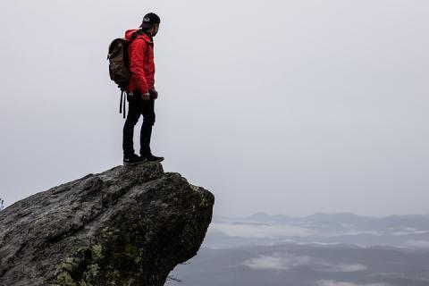 A man standing on a cliff. The Thai for "a man standing on a cliff" is "ผู้ชายยืนบนหน้าผา". A man standing on a cliff. The Thai for "a man standing on a cliff" is "ผู้ชายยืนบนหน้าผา".