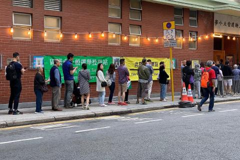People queuing in front of the polling station. The Thai for "people queuing in front of the polling station" is "ประชาชนเข้าแถวหน้าหน่วยเลือกตั้ง". People queuing in front of the polling station. The Thai for "people queuing in front of the polling station" is "ประชาชนเข้าแถวหน้าหน่วยเลือกตั้ง".