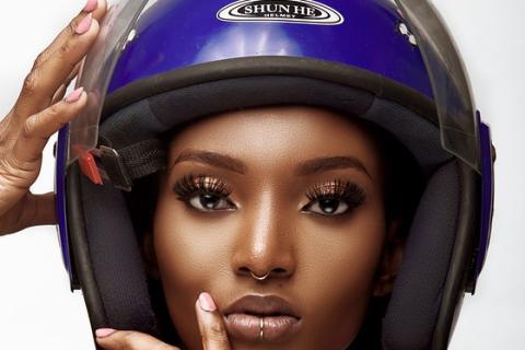 A woman with a blue helmet. The Thai for "a woman with a blue helmet" is "ผู้หญิงกับหมวกกันน็อก". A woman with a blue helmet. The Thai for "a woman with a blue helmet" is "ผู้หญิงกับหมวกกันน็อก".