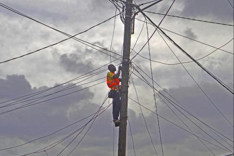 An electrician on an electricity pole. The Thai for "an electrician on an electricity pole" is "ช่างไฟฟ้าบนเสาไฟฟ้า". An electrician on an electricity pole. The Thai for "an electrician on an electricity pole" is "ช่างไฟฟ้าบนเสาไฟฟ้า".