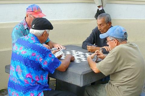 Four men playing dominoes. The Thai for "four men playing dominoes" is "ผู้ชายสี่คนกำลังเล่นโดมิโน". Four men playing dominoes. The Thai for "four men playing dominoes" is "ผู้ชายสี่คนกำลังเล่นโดมิโน".
