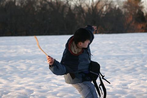 A man is throwing a boomerang on the snow.. The Thai for "A man is throwing a boomerang on the snow." is "ผู้ชายปาบูมเมอแรงบนพื้นหิมะ". A man is throwing a boomerang on the snow.. The Thai for "A man is throwing a boomerang on the snow." is "ผู้ชายปาบูมเมอแรงบนพื้นหิมะ".