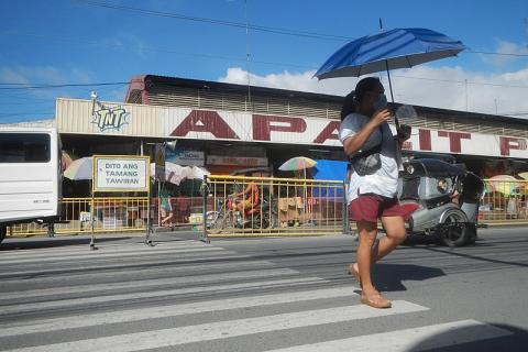 A woman with a blue umbrella crossing at a zebra crossing. The Thai for "a woman with a blue umbrella crossing at a zebra crossing" is "ผู้หญิงกับร่มสีน้ำเงินข้ามทางม้าลาย". A woman with a blue umbrella crossing at a zebra crossing. The Thai for "a woman with a blue umbrella crossing at a zebra crossing" is "ผู้หญิงกับร่มสีน้ำเงินข้ามทางม้าลาย".
