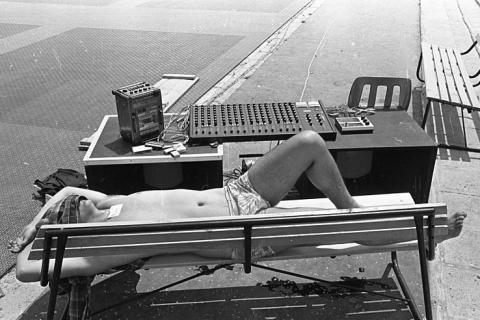 A man sunbathing on a bench. The Thai for "a man sunbathing on a bench" is "ผู้ชายอาบแดดบนม้านั่ง". A man sunbathing on a bench. The Thai for "a man sunbathing on a bench" is "ผู้ชายอาบแดดบนม้านั่ง".