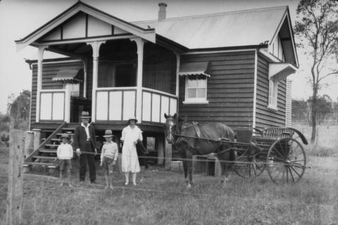 A family and a horse cart in front of their house. The Thai for "a family and a horse cart in front of their house" is "ครอบครัวและรถม้าอยู่หน้าบ้านของพวกเขา". A family and a horse cart in front of their house. The Thai for "a family and a horse cart in front of their house" is "ครอบครัวและรถม้าอยู่หน้าบ้านของพวกเขา".