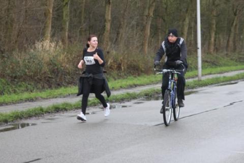 A woman running and a man cycling on a road. The Thai for "a woman running and a man cycling on a road" is "ผู้หญิงวิ่งและผู้ชายขี่จักรยานบนถนน". A woman running and a man cycling on a road. The Thai for "a woman running and a man cycling on a road" is "ผู้หญิงวิ่งและผู้ชายขี่จักรยานบนถนน".