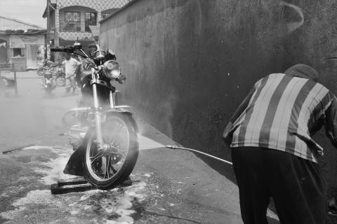 A man is washing his motorbike. The Thai for "a man is washing his motorbike" is "ผู้ชายล้างรถมอร์เตอร์ไซค์ของเขา". A man is washing his motorbike. The Thai for "a man is washing his motorbike" is "ผู้ชายล้างรถมอร์เตอร์ไซค์ของเขา".