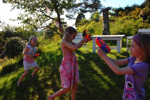 Children playing with water pistols. The Thai for "children playing with water pistols" is "เด็กๆเล่นปืนฉีดน้ำ". Children playing with water pistols. The Thai for "children playing with water pistols" is "เด็กๆเล่นปืนฉีดน้ำ".