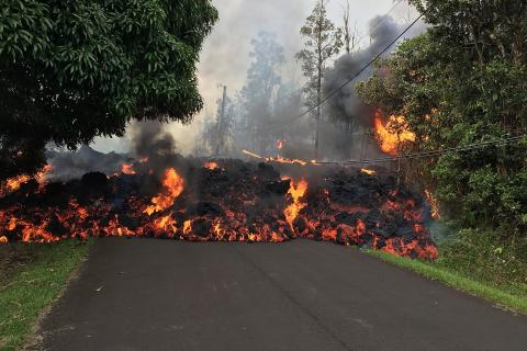 A lava flow moving on a street. The Thai for "a lava flow moving on a street" is "ลาวาเคลื่อนที่ไปบนถนน". A lava flow moving on a street. The Thai for "a lava flow moving on a street" is "ลาวาเคลื่อนที่ไปบนถนน".