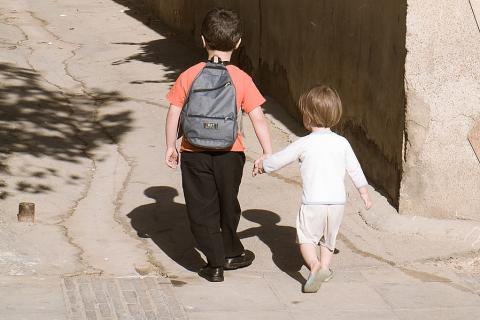 A boy walking hand-in-hand with his younger brother. The Thai for "a boy walking hand-in-hand with his younger brother" is "เด็กผู้ชายจูงมือน้องชายของเขา". A boy walking hand-in-hand with his younger brother. The Thai for "a boy walking hand-in-hand with his younger brother" is "เด็กผู้ชายจูงมือน้องชายของเขา".