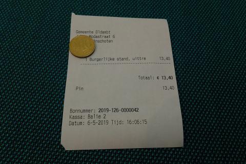 A coin on a bill. The Thai for "a coin on a bill" is "เหรียญบนใบเสร็จ". A coin on a bill. The Thai for "a coin on a bill" is "เหรียญบนใบเสร็จ".