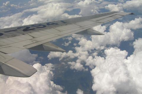 An airplane flying over the clouds. The Thai for "an airplane flying over the clouds" is "เครื่องบินบินเหนือเมฆ". An airplane flying over the clouds. The Thai for "an airplane flying over the clouds" is "เครื่องบินบินเหนือเมฆ".