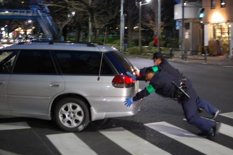 Two policemen pushing a car. The Thai for "two policemen pushing a car" is "ตำรวจสองนายเข็นรถ". Two policemen pushing a car. The Thai for "two policemen pushing a car" is "ตำรวจสองนายเข็นรถ".