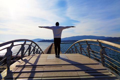 A man on a bridge standing with his arms outstretched. The Thai for "a man on a bridge standing with his arms outstretched" is "ผู้ชายยืนกางแขนบนสะพาน". A man on a bridge standing with his arms outstretched. The Thai for "a man on a bridge standing with his arms outstretched" is "ผู้ชายยืนกางแขนบนสะพาน".