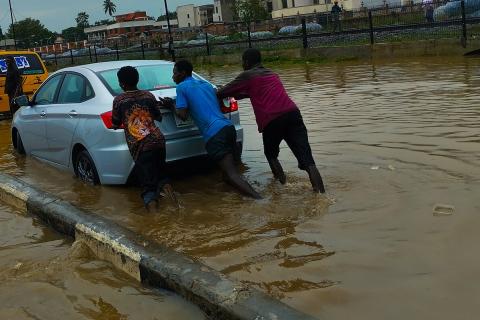 Three men pushing a car in a flood. The Thai for "three men pushing a car in a flood" is "ผู้ชายสามคนเข็นรถในน้ำท่วม". Three men pushing a car in a flood. The Thai for "three men pushing a car in a flood" is "ผู้ชายสามคนเข็นรถในน้ำท่วม".