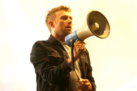 A man holding a megaphone. The Thai for "a man holding a megaphone" is "ผู้ชายถือโทรโข่ง". A man holding a megaphone. The Thai for "a man holding a megaphone" is "ผู้ชายถือโทรโข่ง".