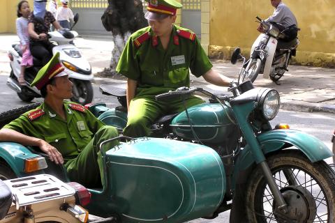 Two policemen on a motorbike with sidecar. The Thai for "two policemen on a motorbike with sidecar" is "ตำรวจสองนายบนมอร์เตอร์ไซค์พ่วงข้าง". Two policemen on a motorbike with sidecar. The Thai for "two policemen on a motorbike with sidecar" is "ตำรวจสองนายบนมอร์เตอร์ไซค์พ่วงข้าง".