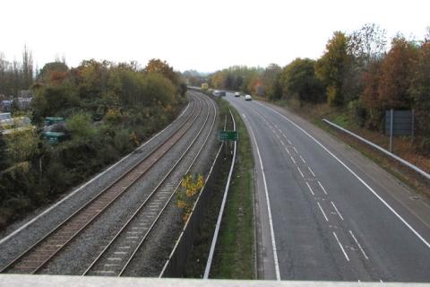 A parallel road and railway. The Thai for "a parallel road and railway" is "ถนนขนานกับรางรถไฟ". A parallel road and railway. The Thai for "a parallel road and railway" is "ถนนขนานกับรางรถไฟ".