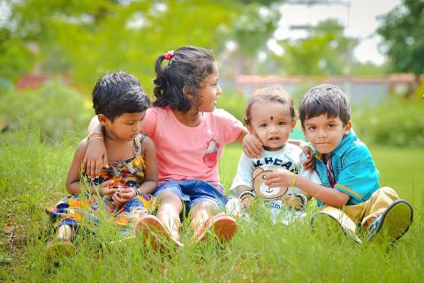 Children sitting in the garden.. The Thai for "Children sitting in the garden." is "เด็กๆนั่งเล่นอยู่ในสวน". Children sitting in the garden.. The Thai for "Children sitting in the garden." is "เด็กๆนั่งเล่นอยู่ในสวน".